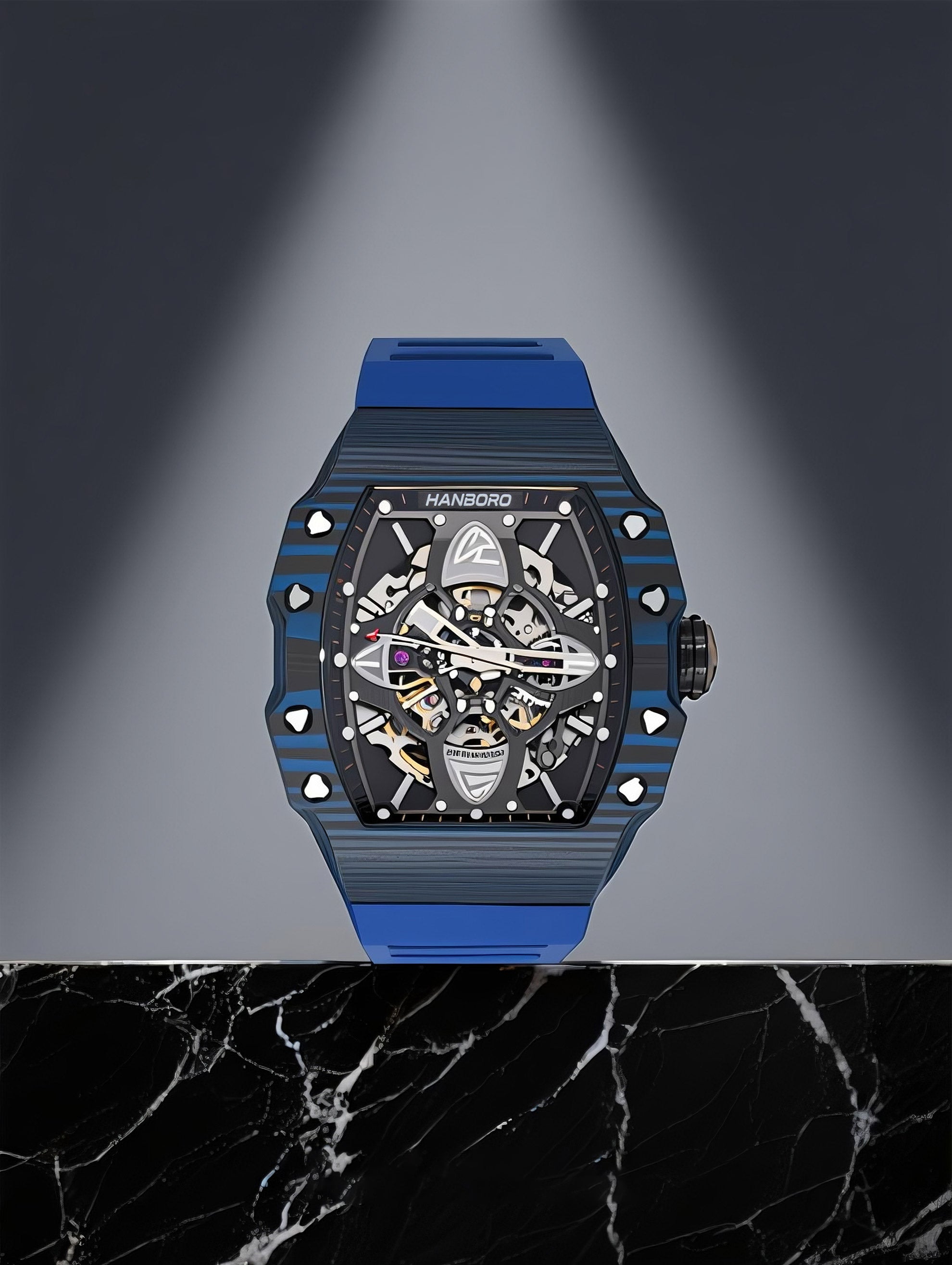 Own Your Bloom men’s mechanical watch displayed on marble pedestal under spotlight, lifestyle composition, Seattle.