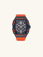 Own Your Bloom men’s skeleton automatic watch, 304 stainless steel with orange strap, angled product shot on white, New York.