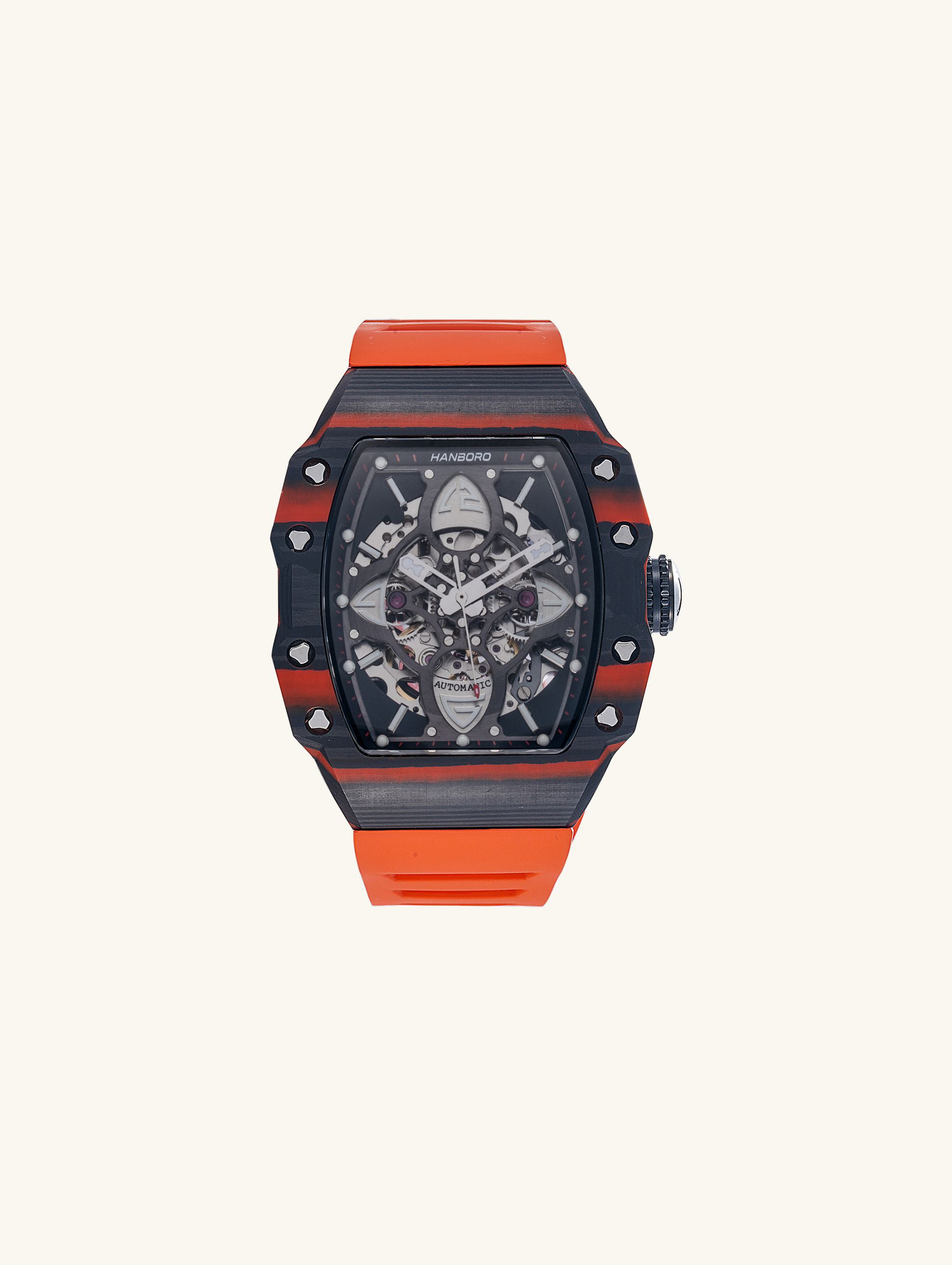 Own Your Bloom men’s skeleton automatic watch, 304 stainless steel with orange strap, angled product shot on white, New York.