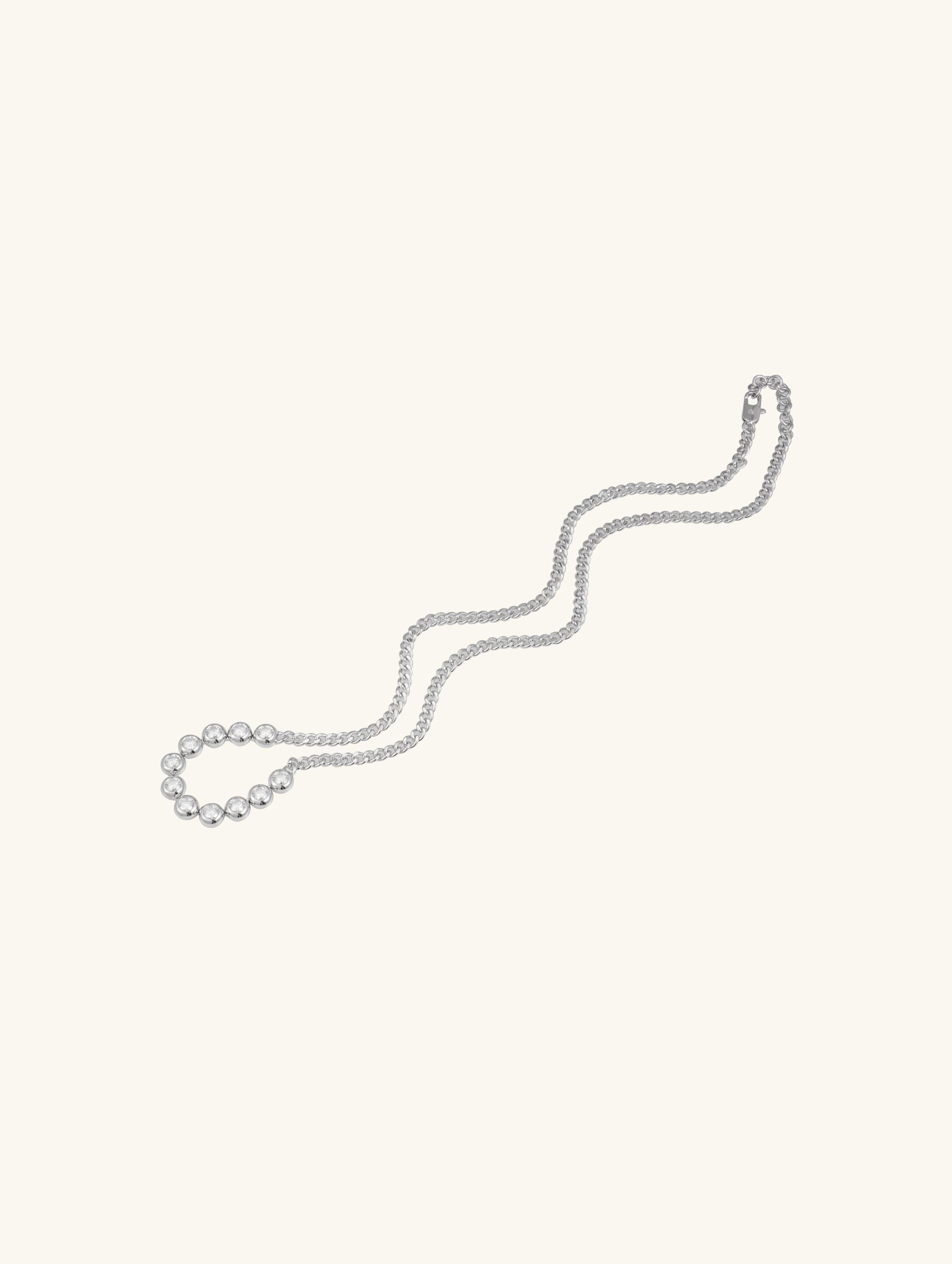 Own Your Bloom minimalist silver bezel moissanite necklace close-up showing brilliance and fine setting, Chicago.