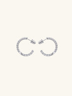 Own Your Bloom moissanite half hoop earrings front view in white gold, showcasing brilliant-cut moissanite stones in sleek half circle design, New York.