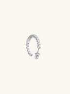 Own Your Bloom half hoop moissanite diamond earrings detailed view with open curve setting and reflective shine, contemporary style, Chicago.