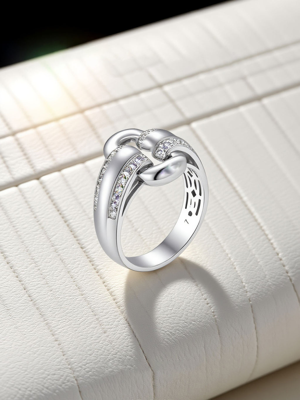 Own Your Bloom moissanite link ring artistic flat lay showing elegant curves and craftsmanship, Boston.