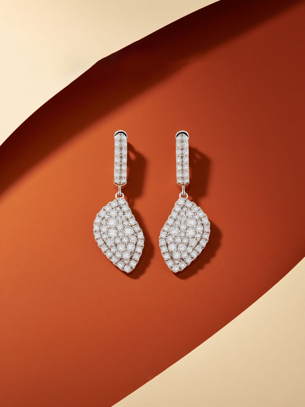 Own Your Bloom moissanite radiant drape earrings showcased under soft light with modern warm tones, premium jewelry elegance, Dallas.
