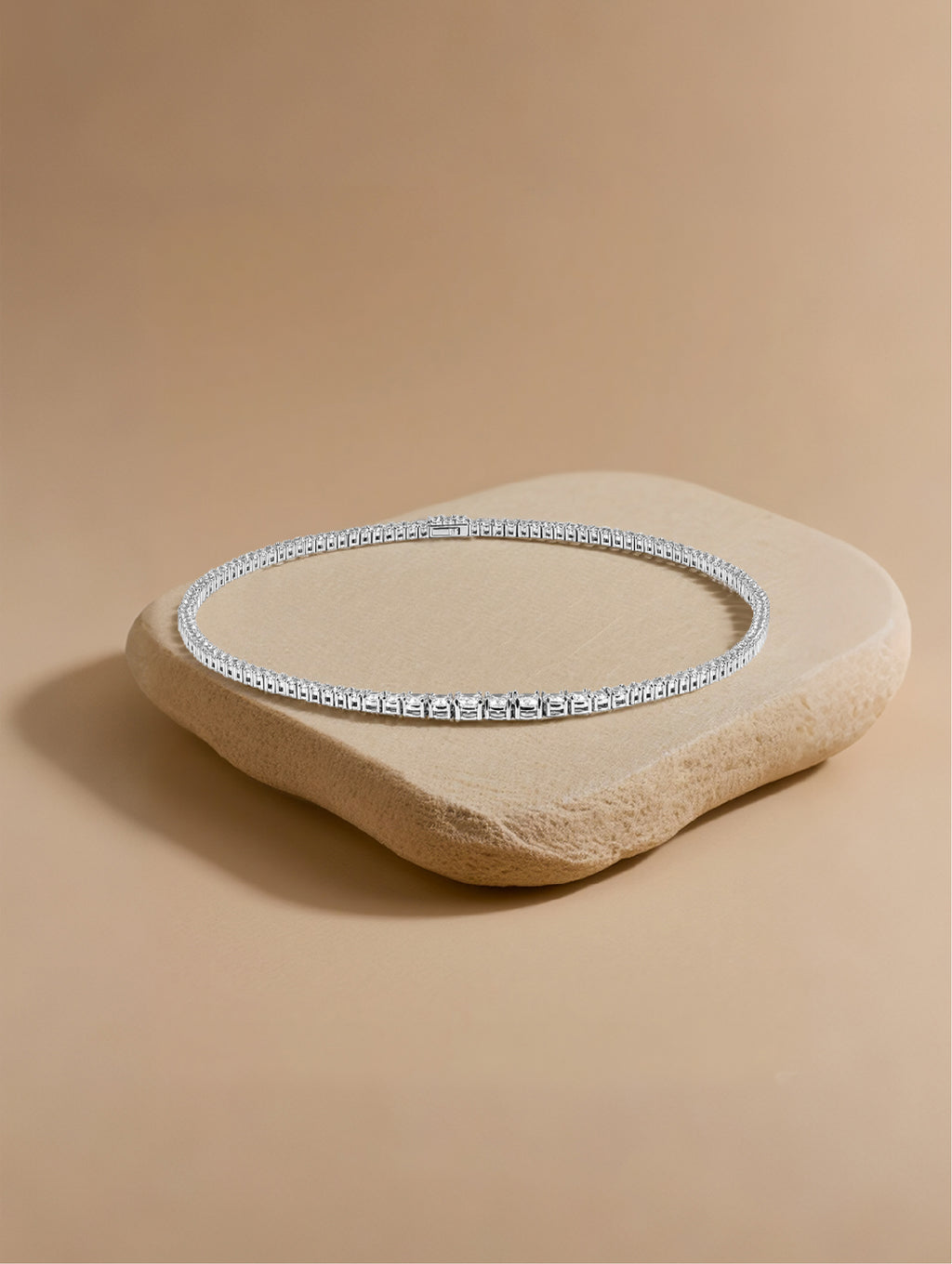 Own Your Bloom moissanite tennis necklace photographed under warm daylight on stone texture, Dallas.