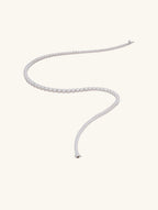 Own Your Bloom moissanite tennis necklace close-up showing radiant cut gemstones and smooth white gold finish, Chicago