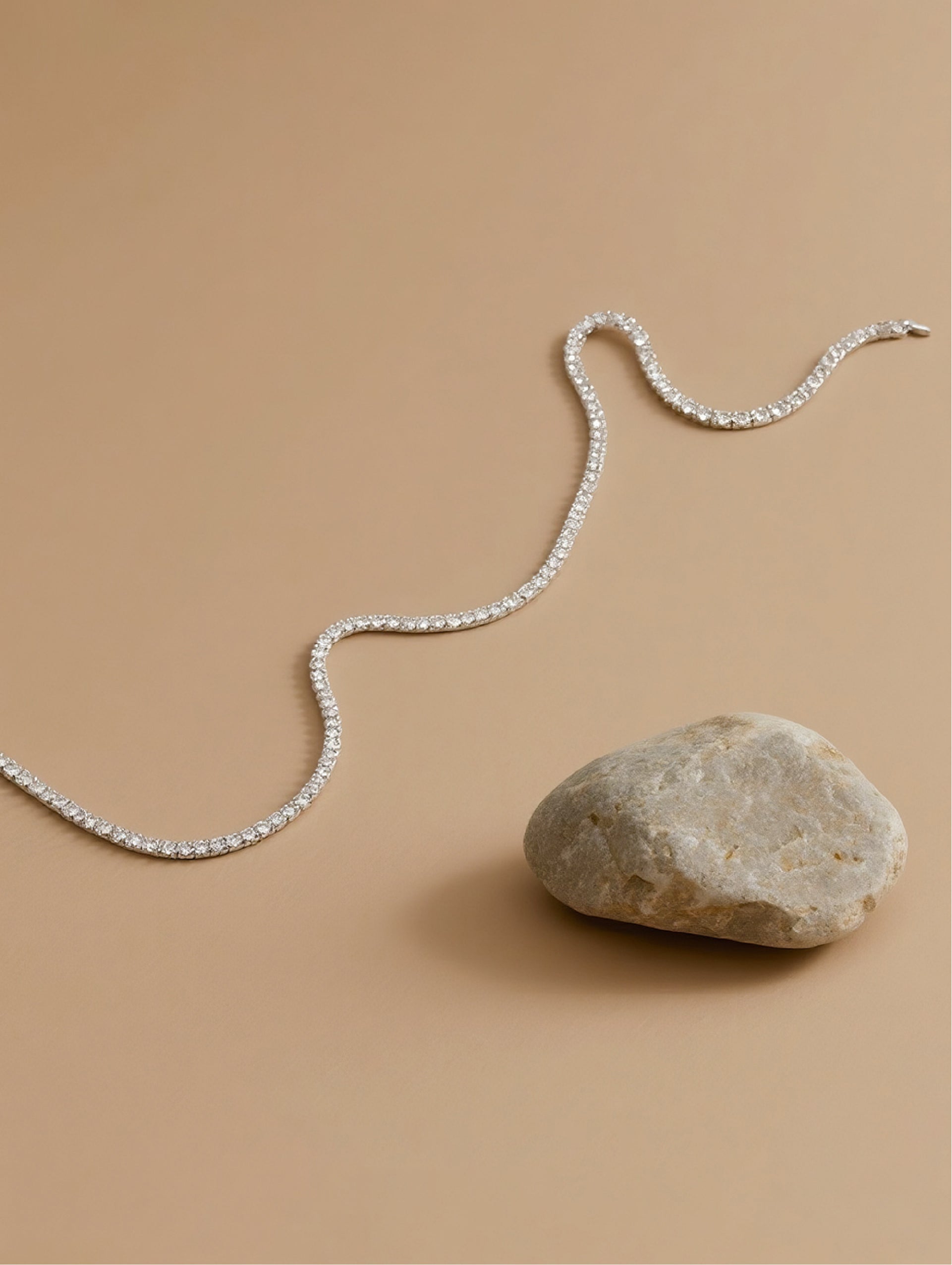Own Your Bloom 14K tennis necklace with moissanite stones displayed on soft beige background, contemporary elegance, Boston.