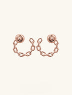 Own Your Bloom Orbit of Daring Earrings top view with circular chain design and crystal-studded sphere studs, Chicago.