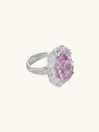 Own Your Bloom oval pink diamond ring, side profile with halo detail on white background, Chicago.