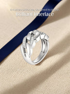 Own Your Bloom pavé Cuban link chain ring on beige fabric with blue ribbon, high-end jewelry photography, Miami.