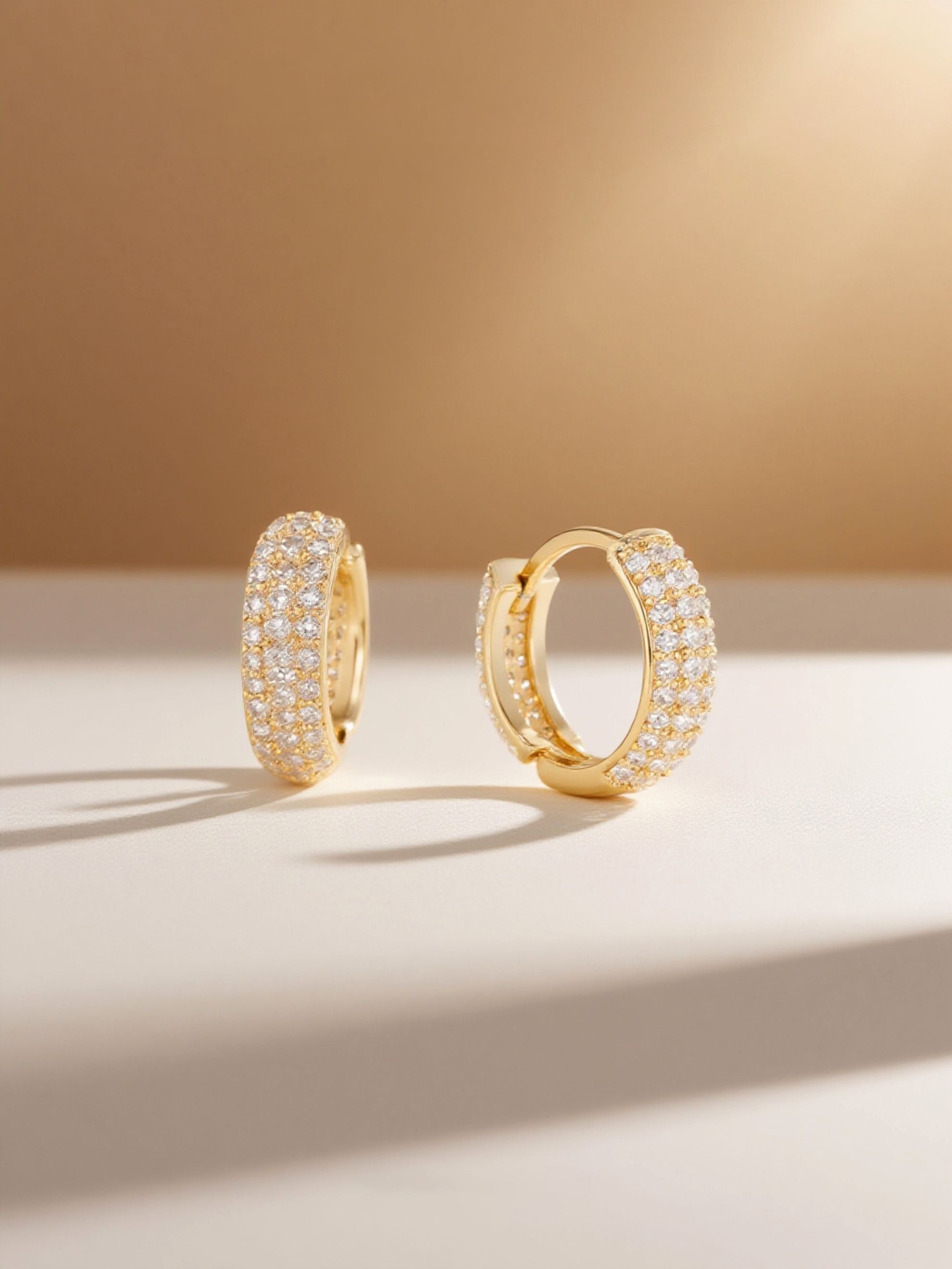 Studio hero of Own Your Bloom gold-plated pavé hoop earrings with high-shine finish.