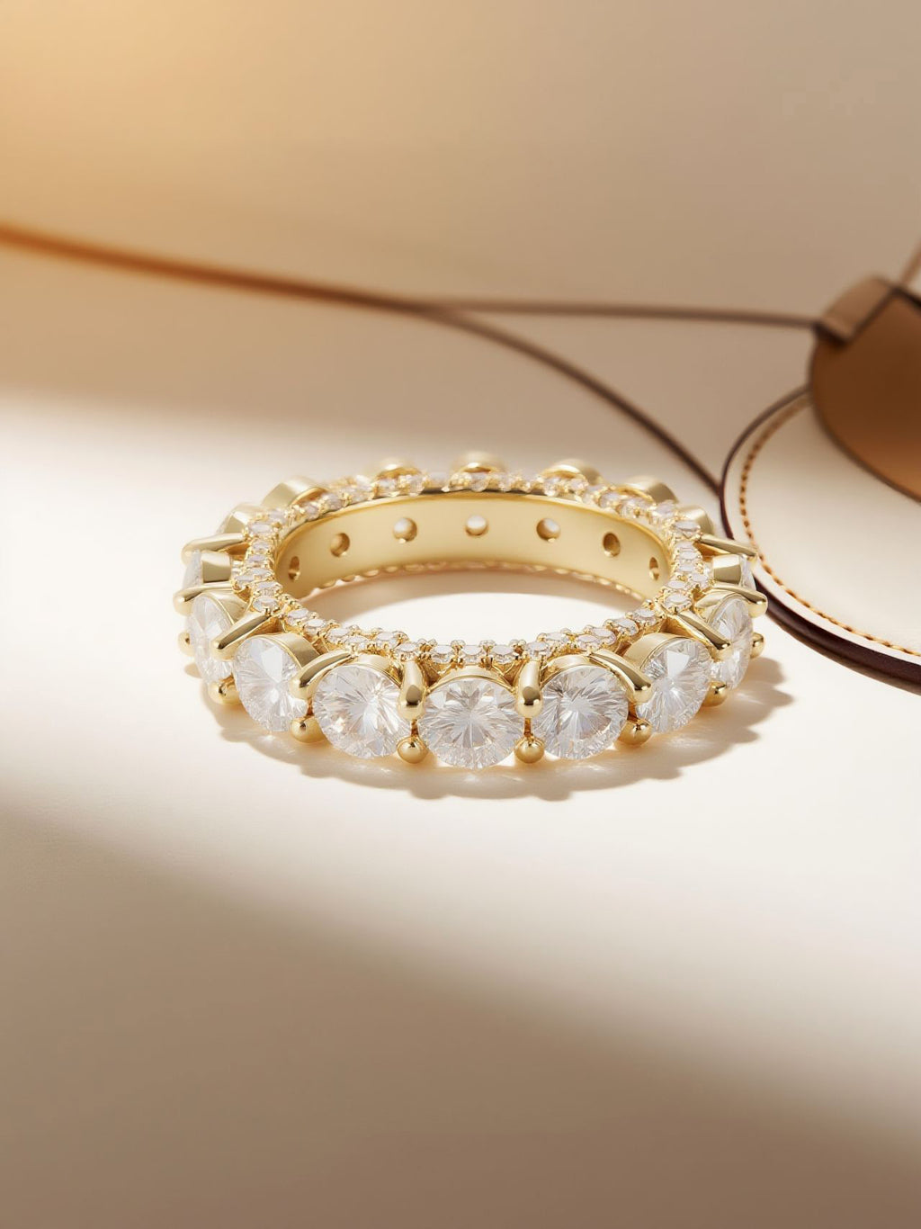 Studio hero of Own Your Bloom yellow gold–plated prong-set full-circle diamond eternity ring.