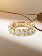 Studio hero of Own Your Bloom yellow gold–plated prong-set full-circle diamond eternity ring.