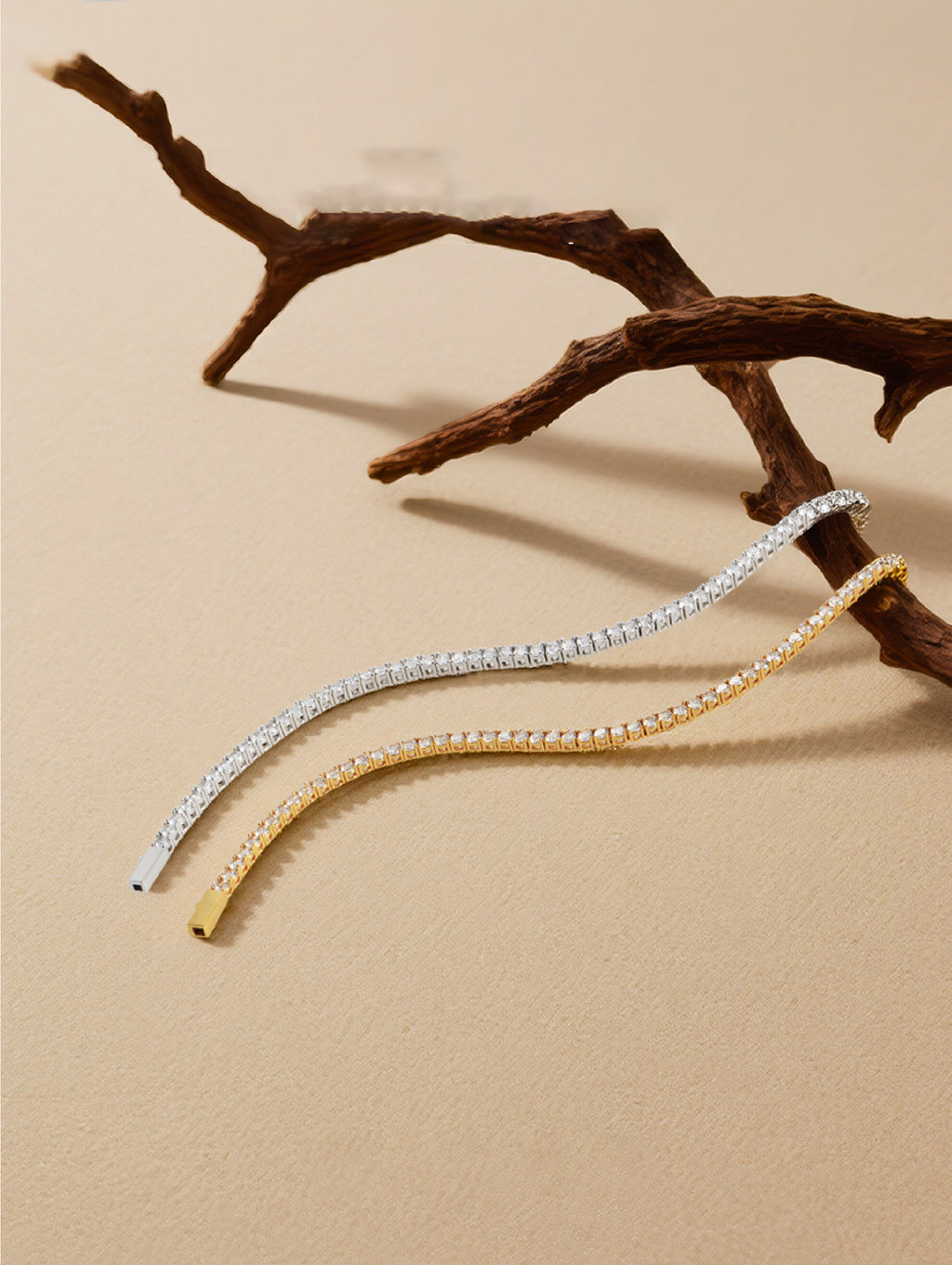 Own Your Bloom Radiant Rhythm Tennis Bracelet gold and silver edition displayed on beige background with organic wood accent, Dallas.