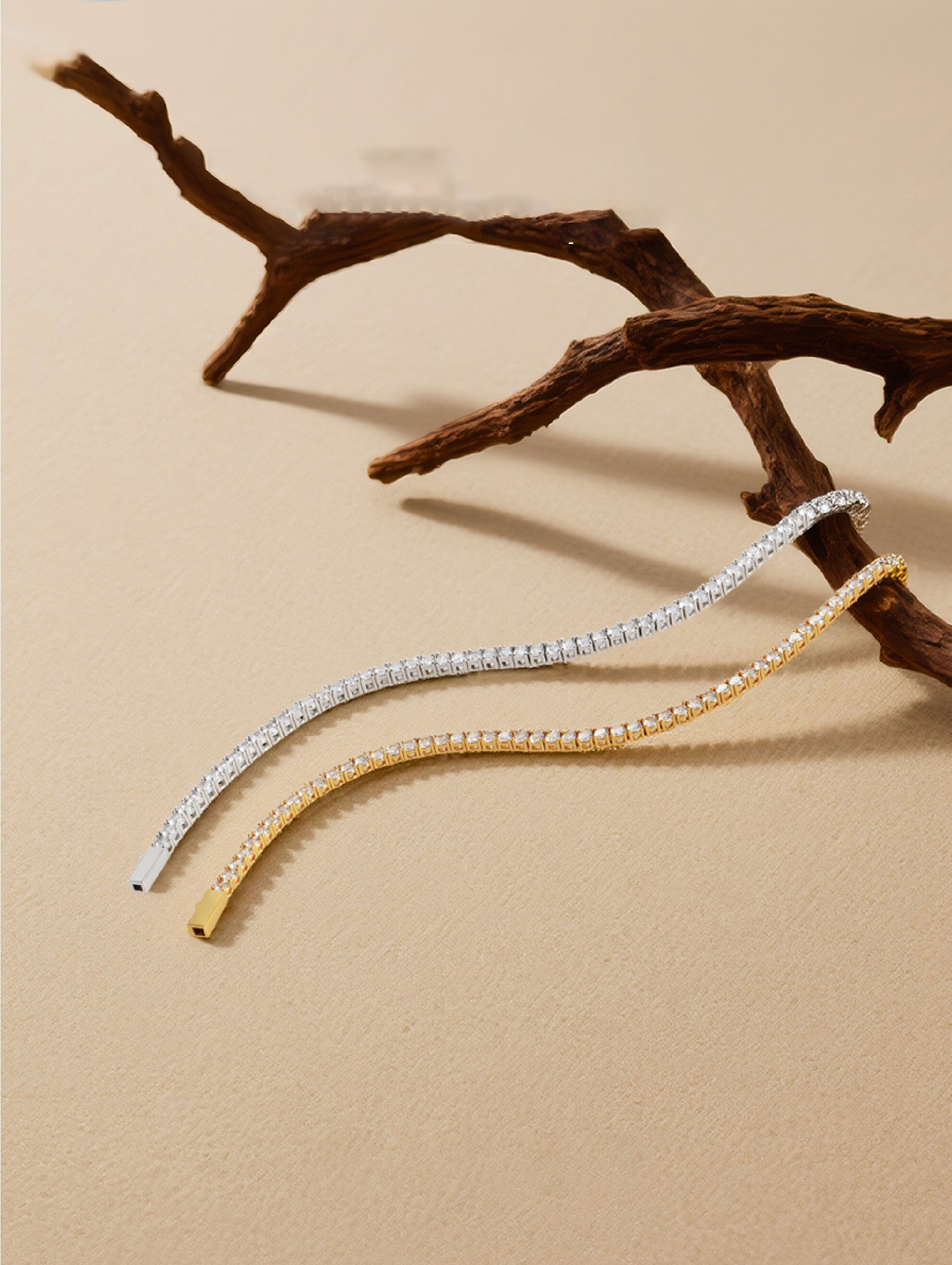 Own Your Bloom Radiant Rhythm Tennis Bracelet gold and silver edition displayed on beige background with organic wood accent, Dallas.