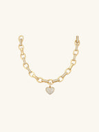 Own Your Bloom Rose Gold Heart Link Bracelet top view highlighting luxury gold finish and sparkling diamond heart charm, Chicago.
