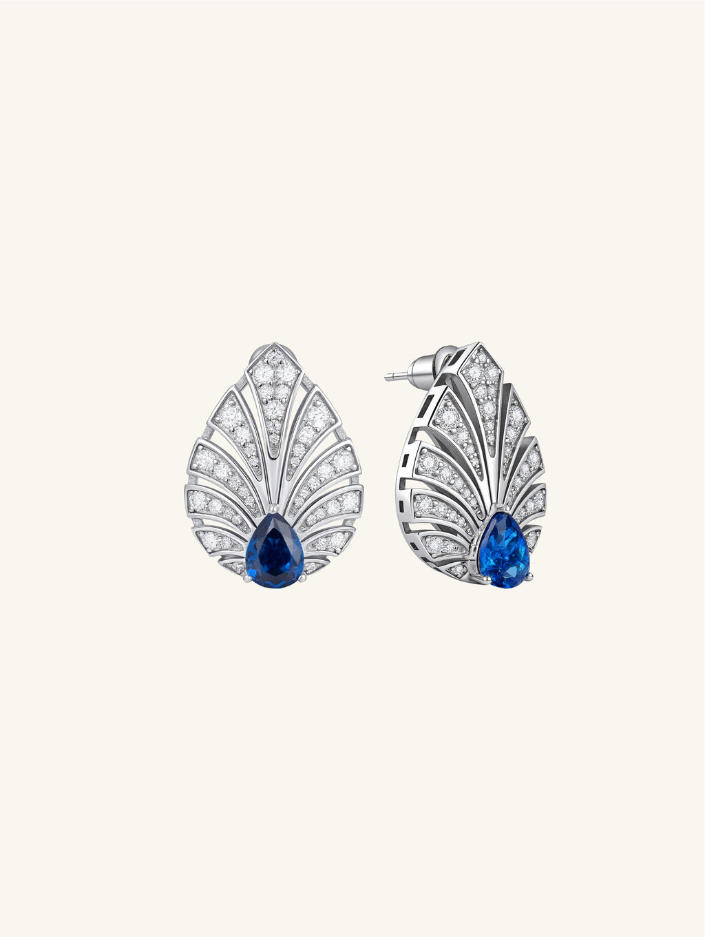 Own Your Bloom Brilliant Gleam sapphire earrings side angle showing radiant pear-cut gemstone framed by diamond rays, Los Angeles.