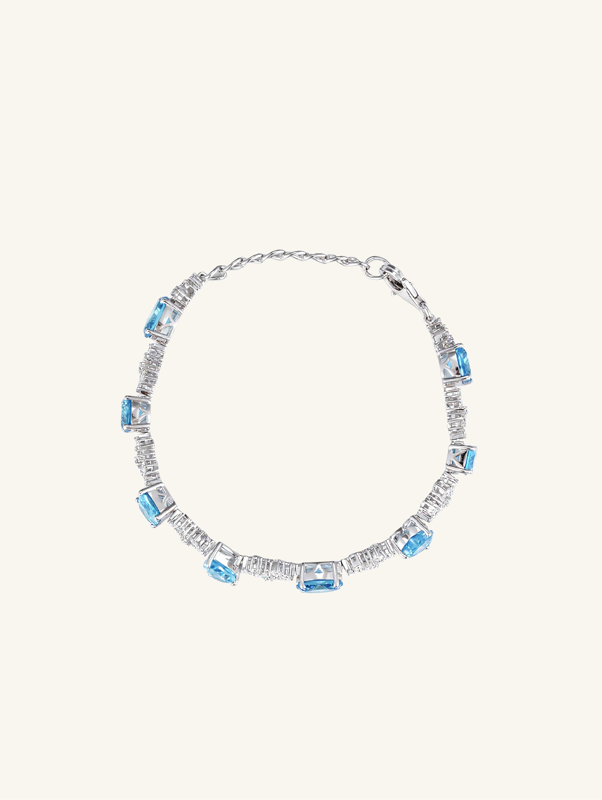 Own Your Bloom blue sapphire tennis bracelet side view showcasing radiant gemstone arrangement and refined craftsmanship, Los Angeles.