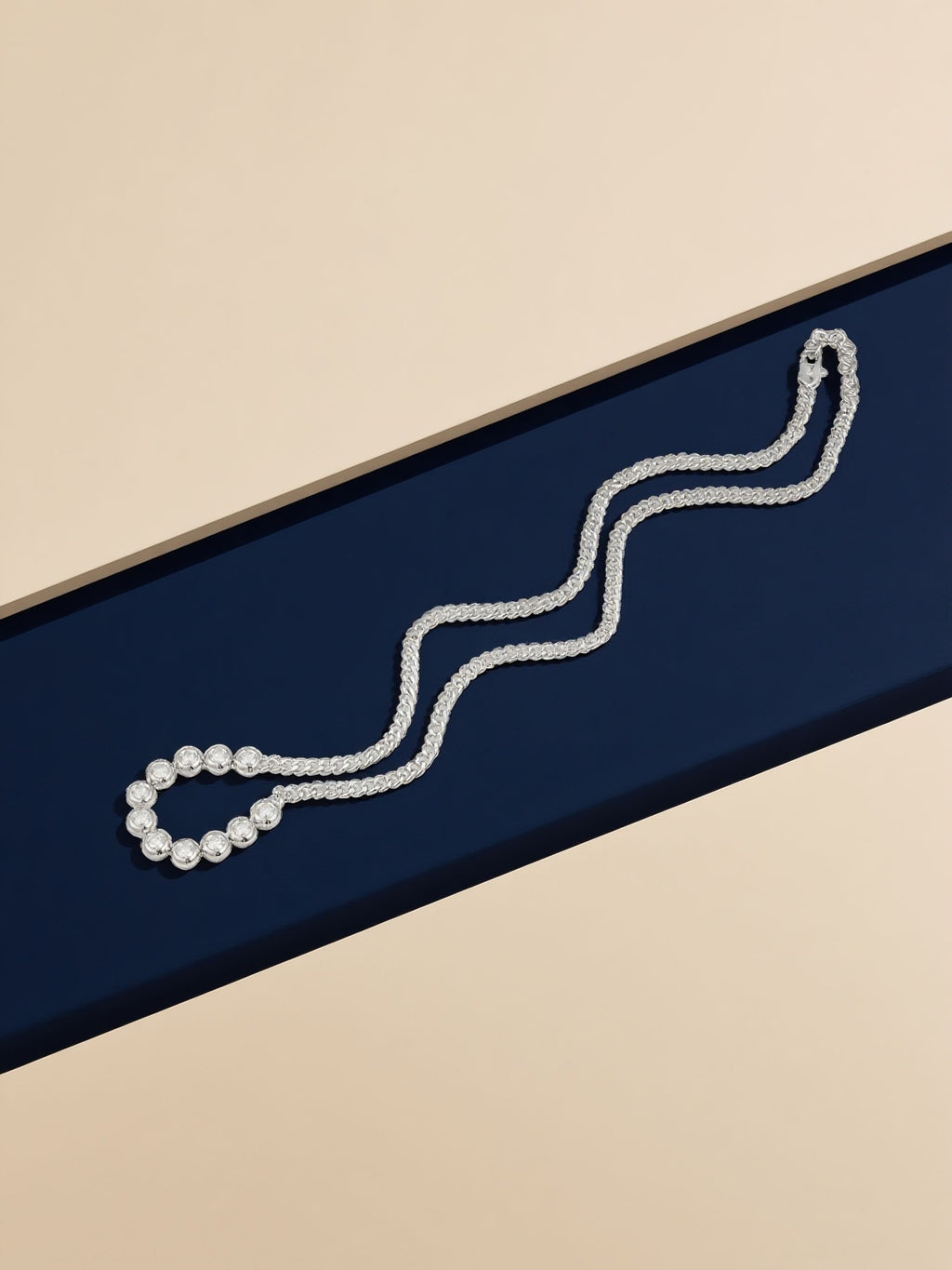 Own Your Bloom silver moissanite chain necklace with symmetrical round stones in contemporary showcase, Dallas.