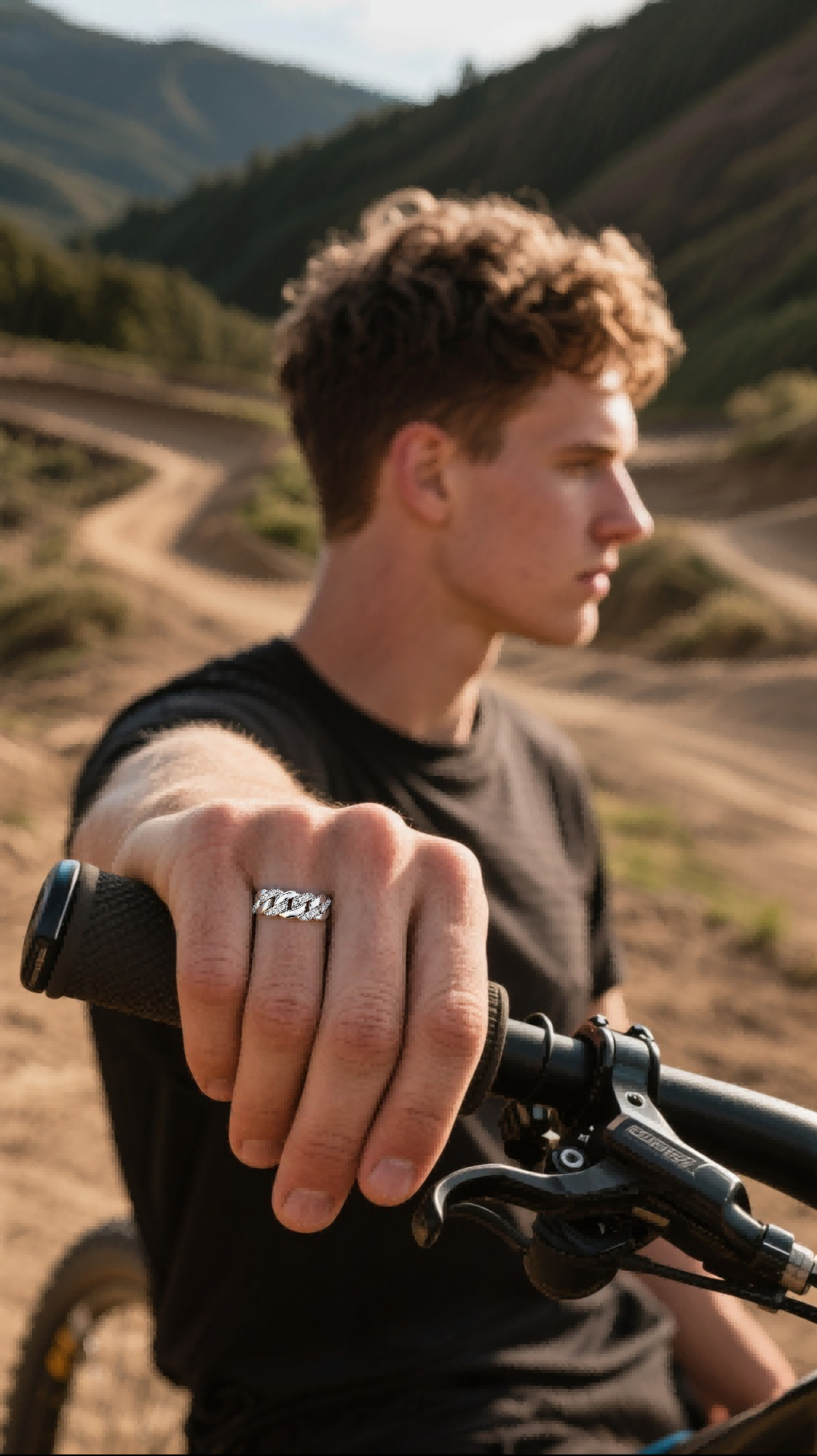 Own Your Bloom pavé Cuban link diamond ring on woman with curly hair in nature, elegant and powerful jewelry style, New York.