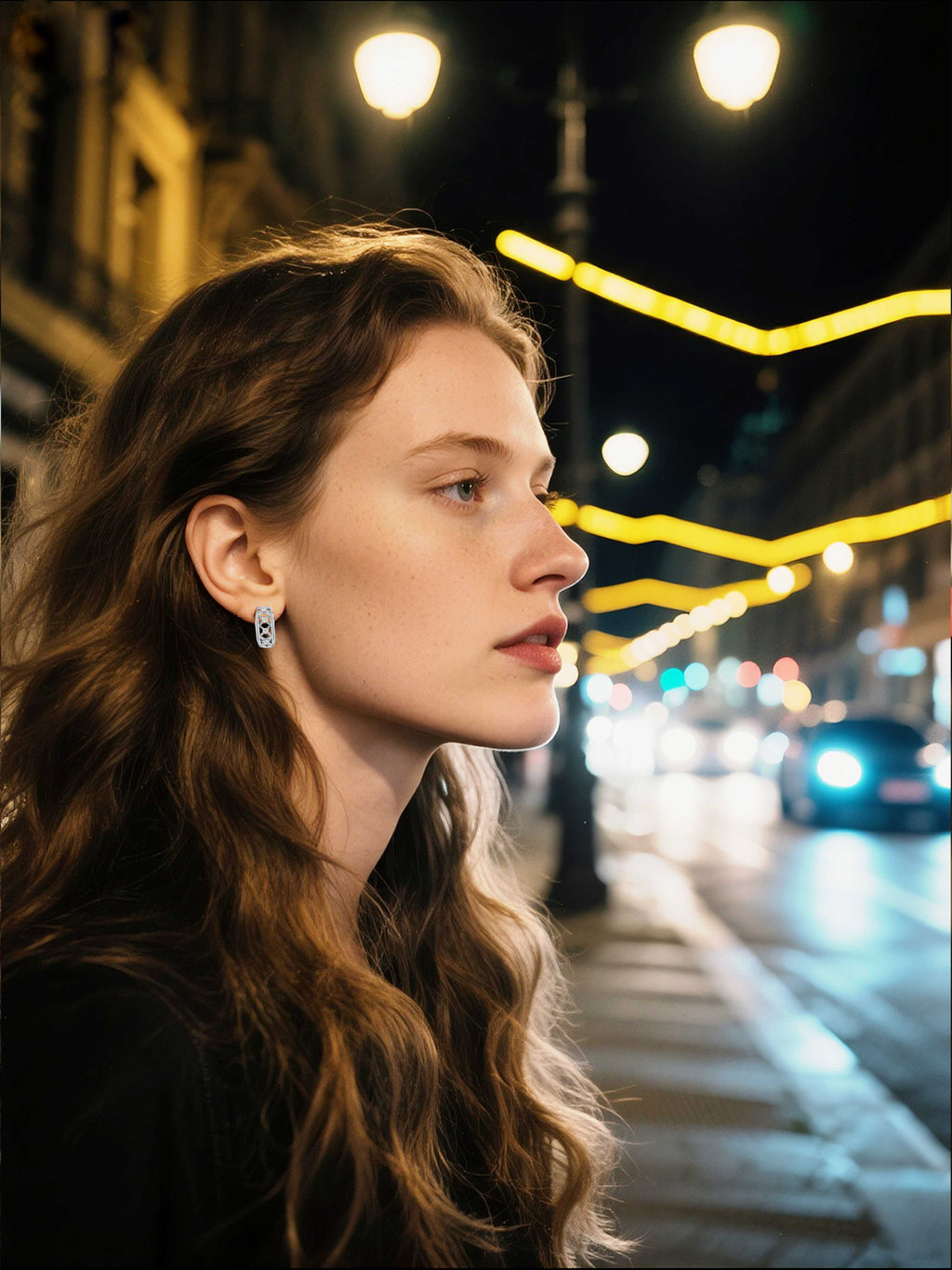 Own Your Bloom silver lattice geometric earrings worn by woman at night in city lights, modern urban jewelry style, New York.