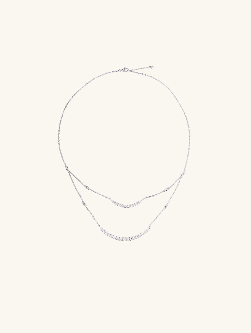 Own Your Bloom Silver Layered Necklace flatlay displaying modern two-tier crystal design and adjustable clasp, Chicago.