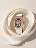 Own Your Bloom skull diamond quartz women’s watch with rose gold frame and white strap, studio display under soft light, Los Angeles.