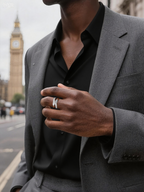 Own Your Bloom silver diamond crossover ring on man’s hand in business attire, stylish luxury jewelry look, Los Angeles.