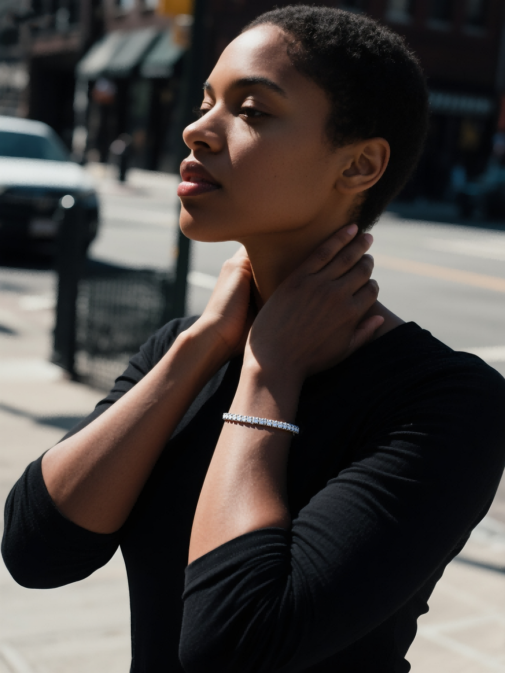 Own Your Bloom Radiant Rhythm Gold Tennis Bracelet worn by woman in natural light, everyday sophistication and charm, Miami.
