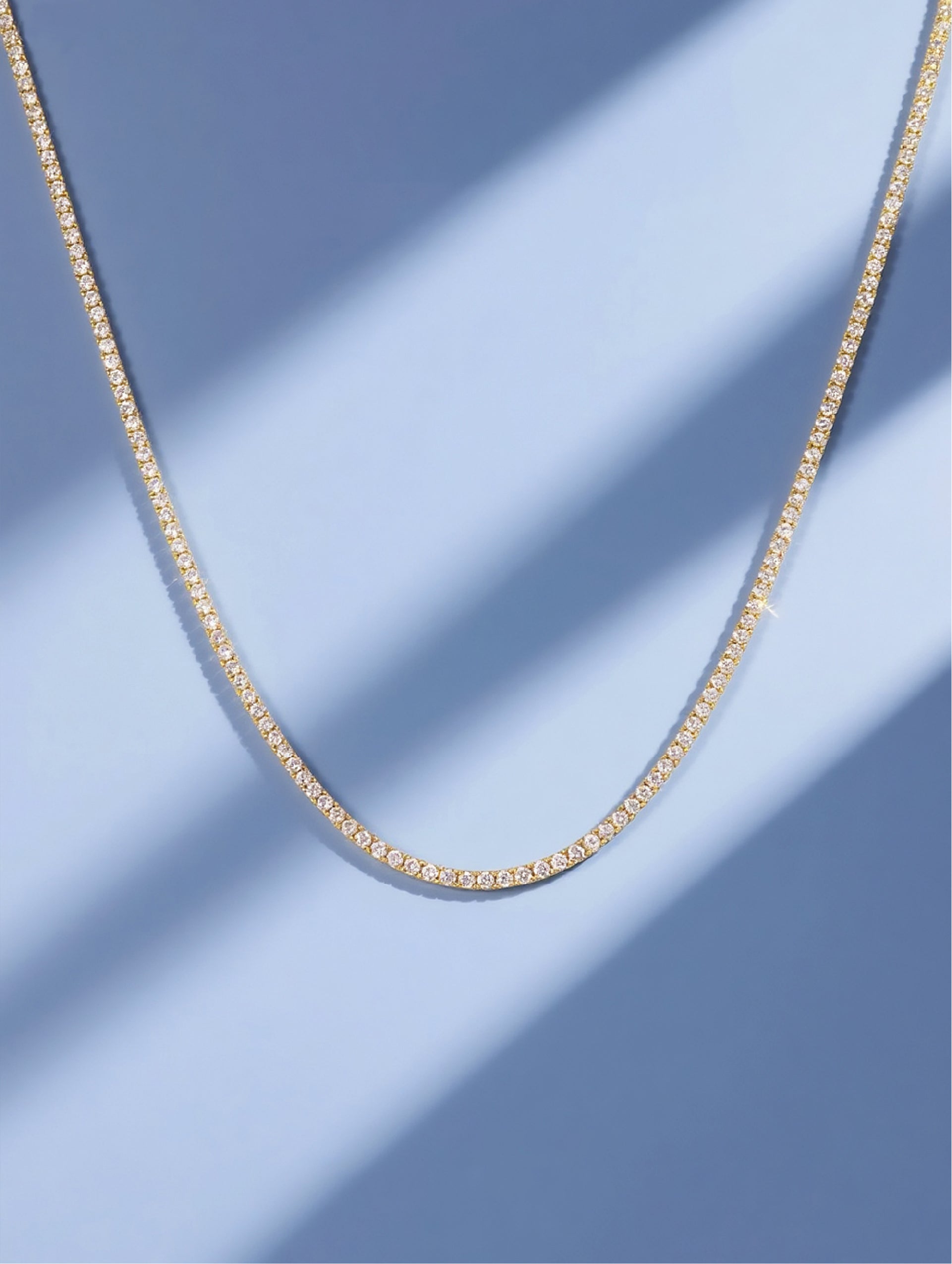 Own Your Bloom Tennis Diamond Necklace in studio shot showing minimalist lines and luminous brilliance, Dallas.