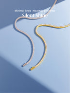 Own Your Bloom Tennis Necklace in gold and silver side by side, displayed to showcase versatility and sophistication, Boston.