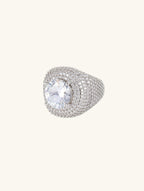 Angled view of Own Your Bloom wide-band pavé ring in white-gold-plated finish with sparkling center stone.