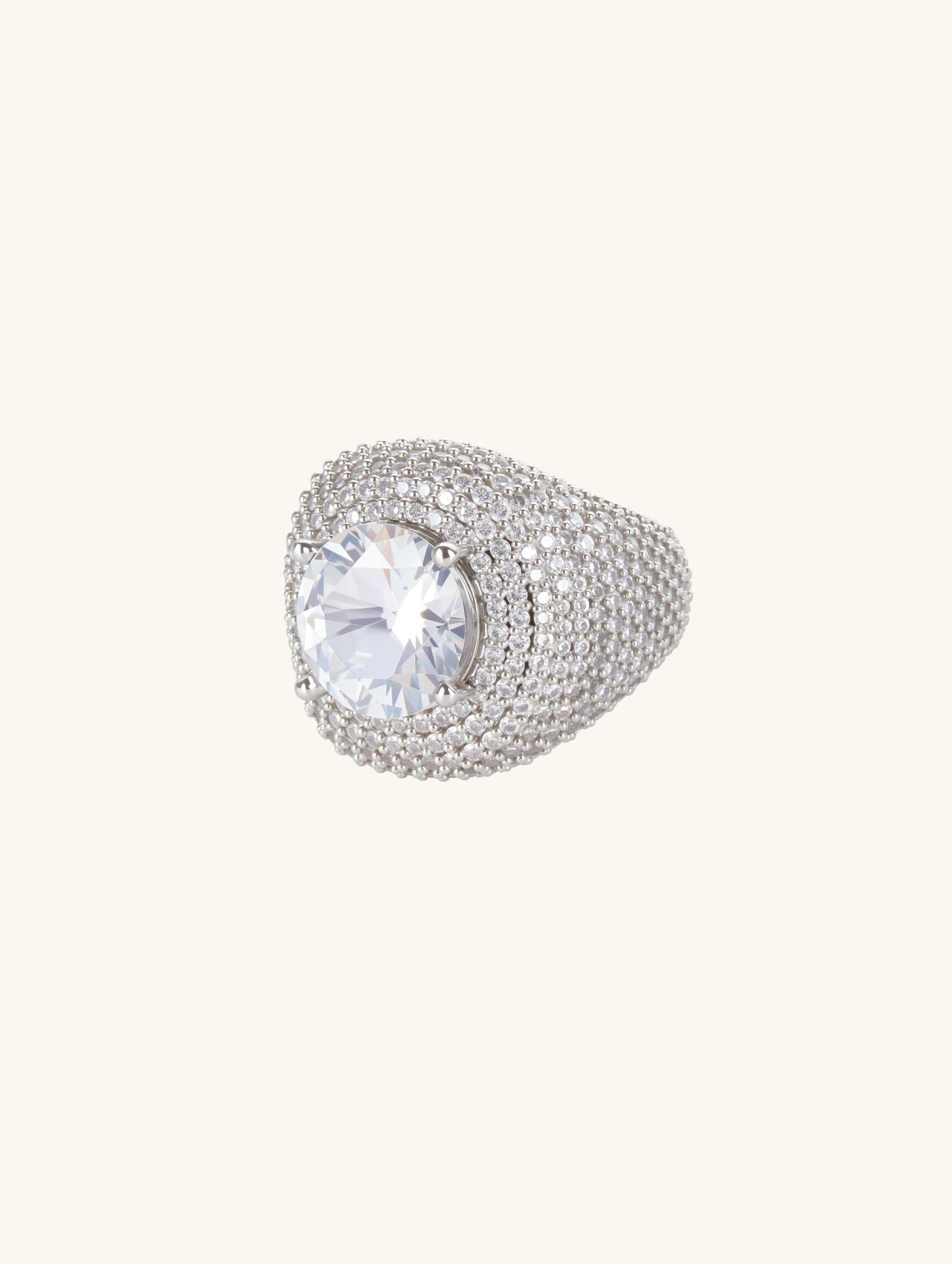 Angled view of Own Your Bloom wide-band pavé ring in white-gold-plated finish with sparkling center stone.