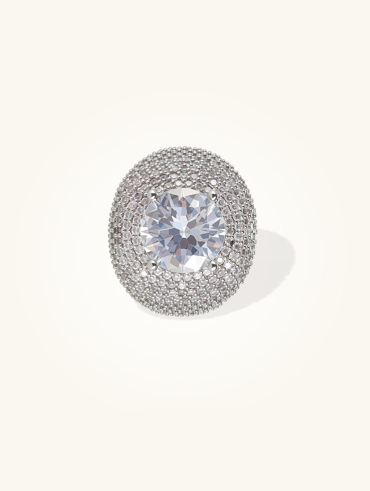 Own Your Bloom 14K white gold–plated wide-band pavé ring with round center stone, front view on white background.