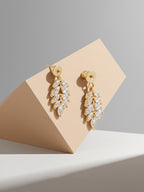 Angled view of Own Your Bloom Willow Leaf diamond stud earrings on prop block, Seattle.