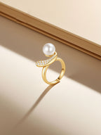 Own Your Bloom pearl diamond ring lifestyle still on warm gradient backdrop, Radiance in Motion theme, Miami FL